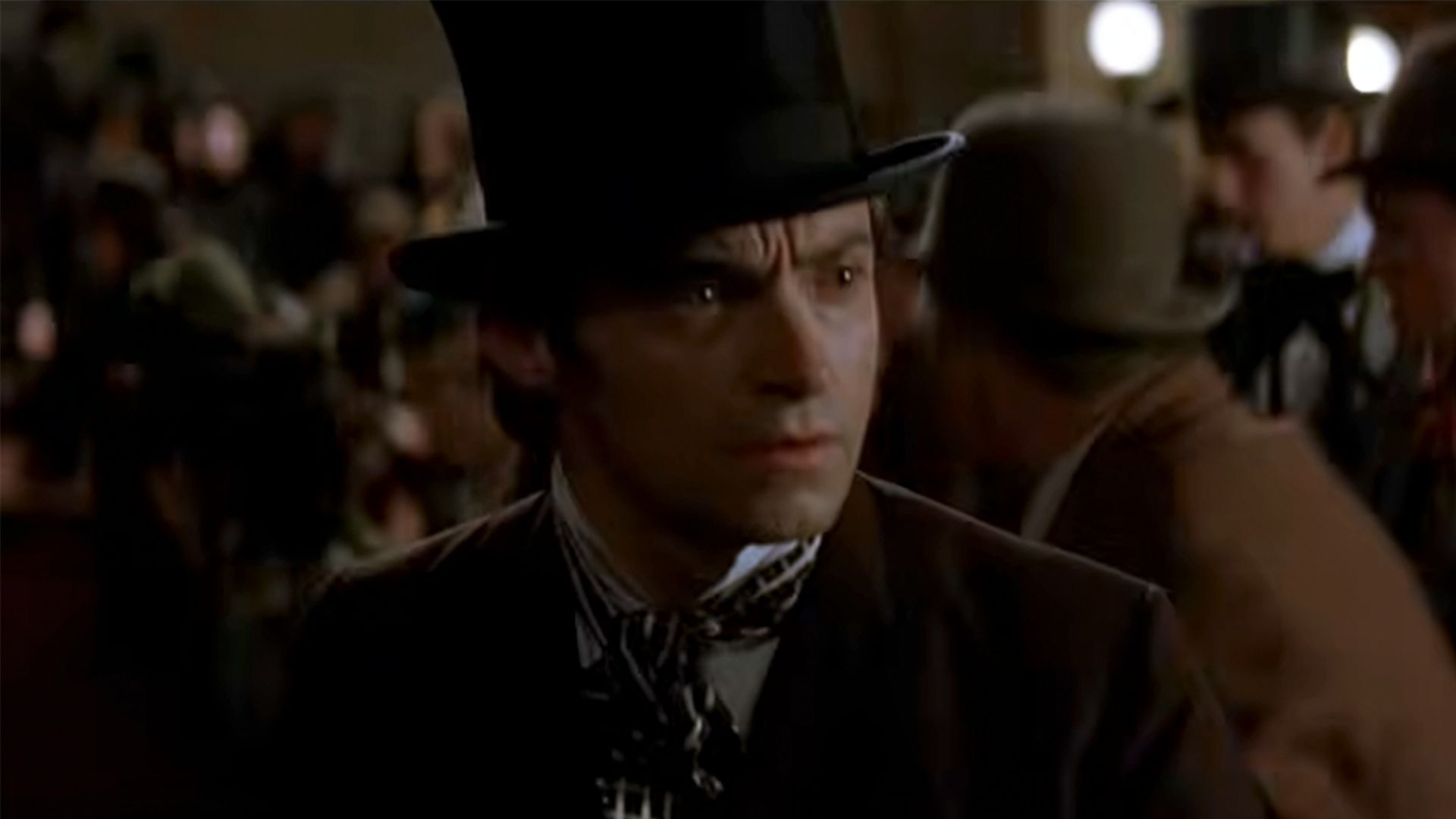 Hugh Jackman in a top hat, looking concerned in The Prestige