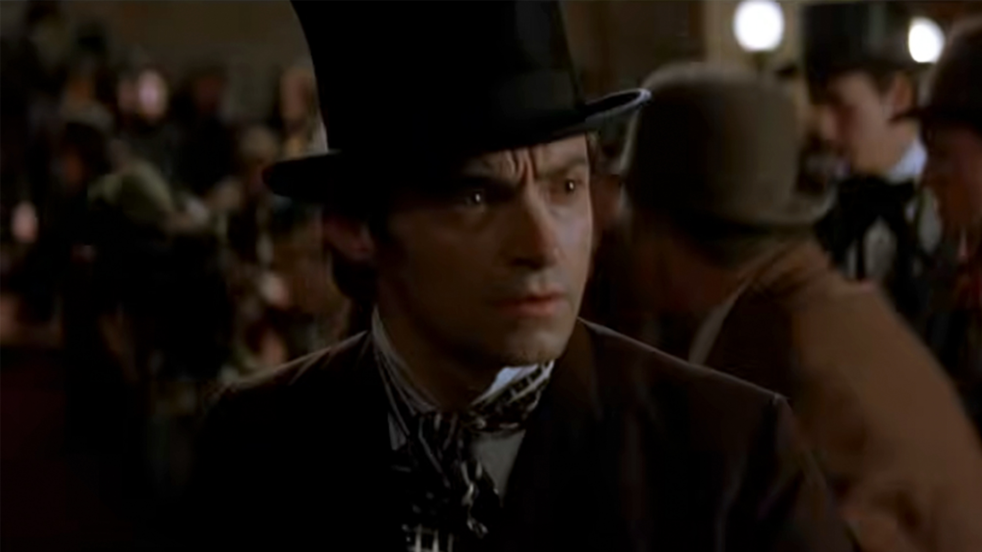 Hugh Jackman in a top hat, looking concerned in The Prestige