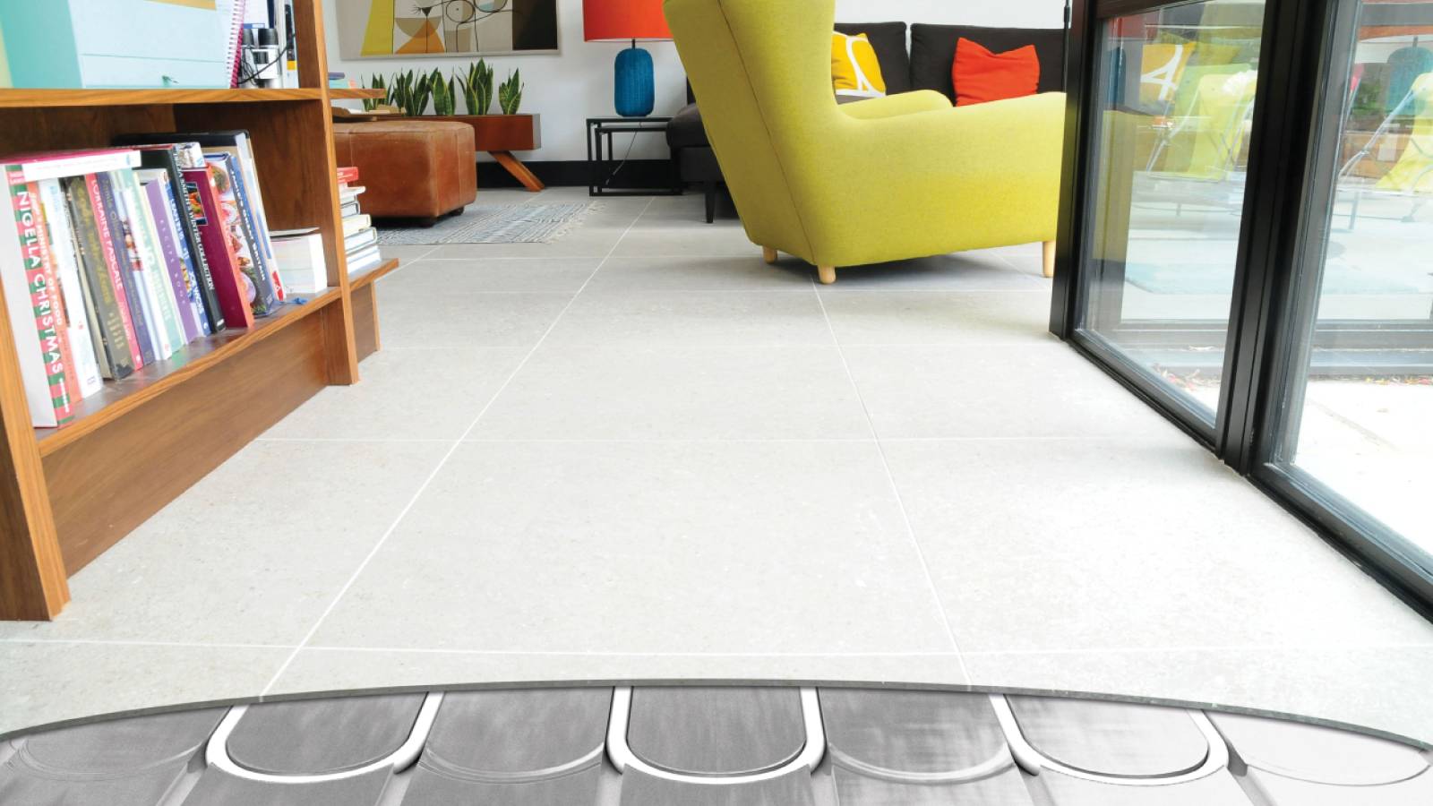 living room with floor tiles exposed showing underfloor heating below