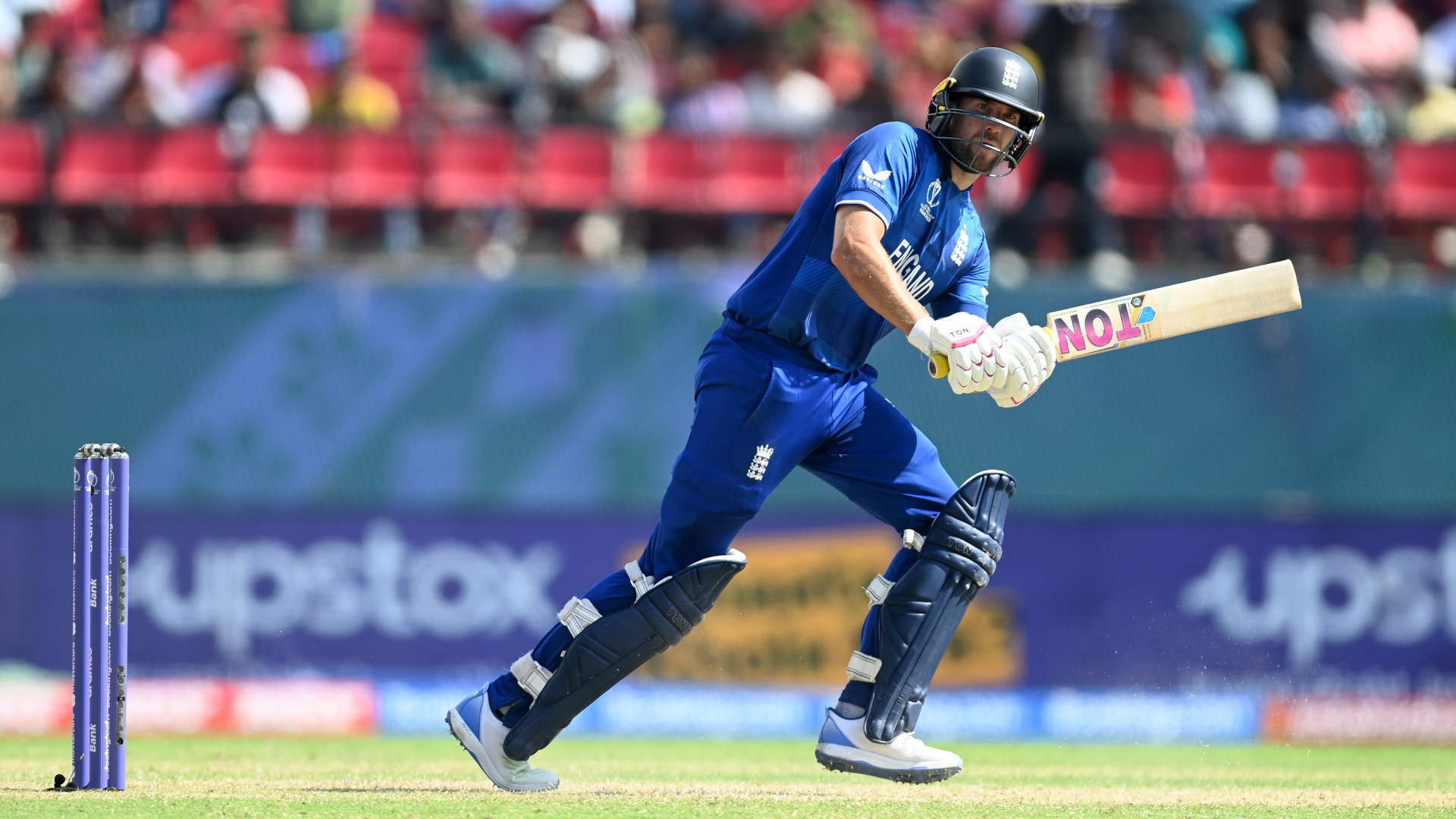 Why are England wearing blue instead of red at the Cricket World