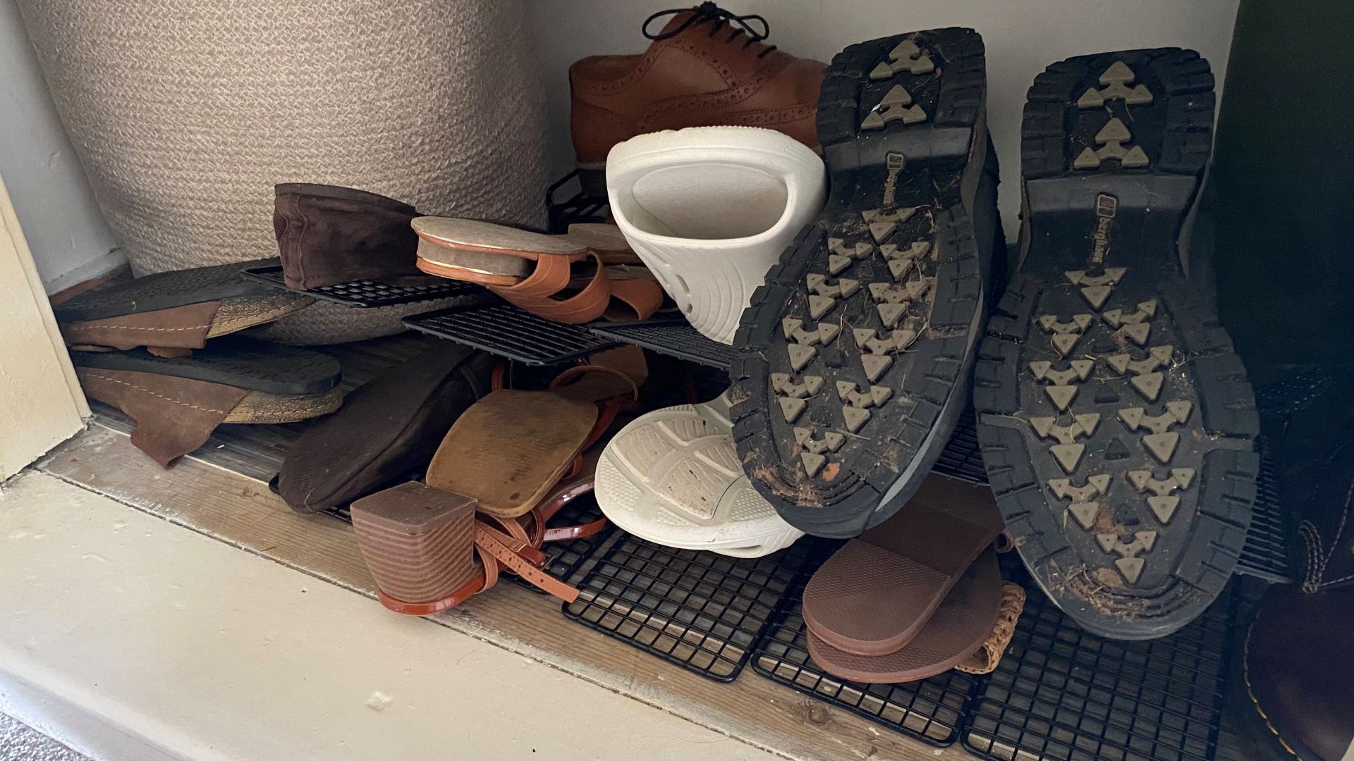 Shoes in bottom of wardrobe placed upside down