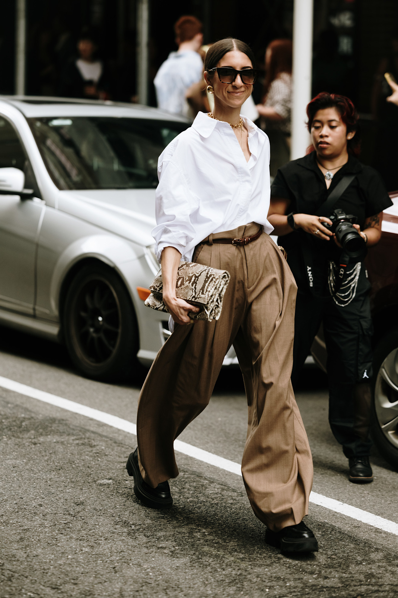 woman wearing a button-down and oversized pants in New York