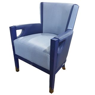 blue coloured arm chair with cushions