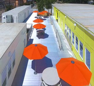 orange umbrellas and lime exterior with windows