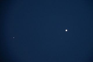 jupiter is the bright dot on the right and mars the bright small dot to the left.