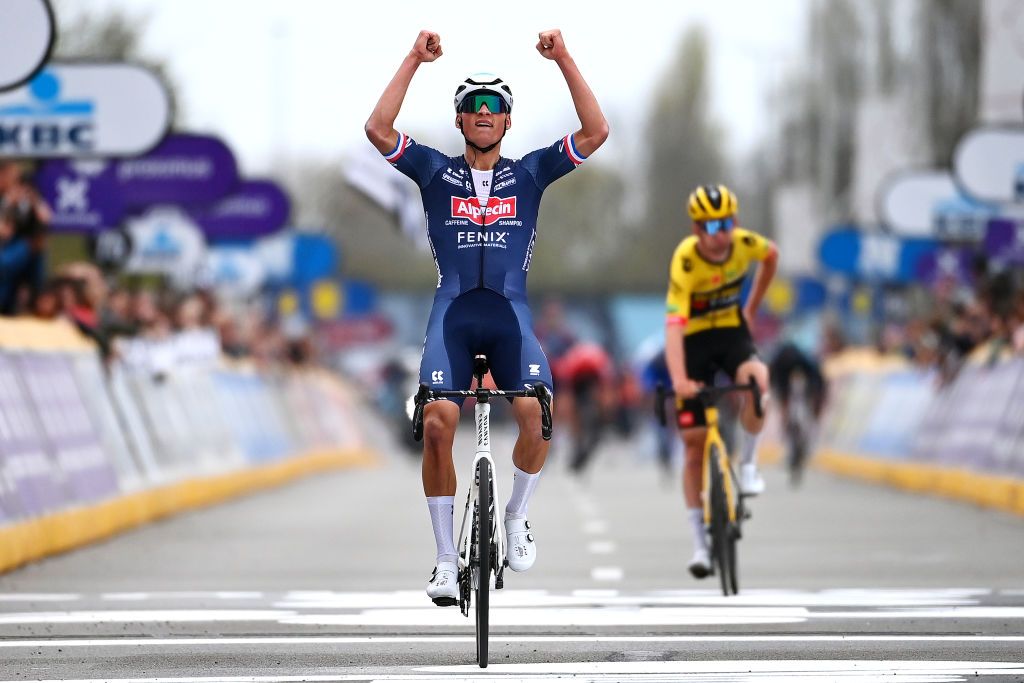 WAREGEM BELGIUM MARCH 30 Mathieu Van Der Poel of Netherlands and Team AlpecinFenix celebrates at finish line as race winner during the 76th Dwars Door Vlaanderen 2022 Mens Elite a 1837km one day race from Roeselare to Waregem DDV22 DDVmen WorldTour on March 30 2022 in Waregem Belgium Photo by Tim de WaeleGetty Images