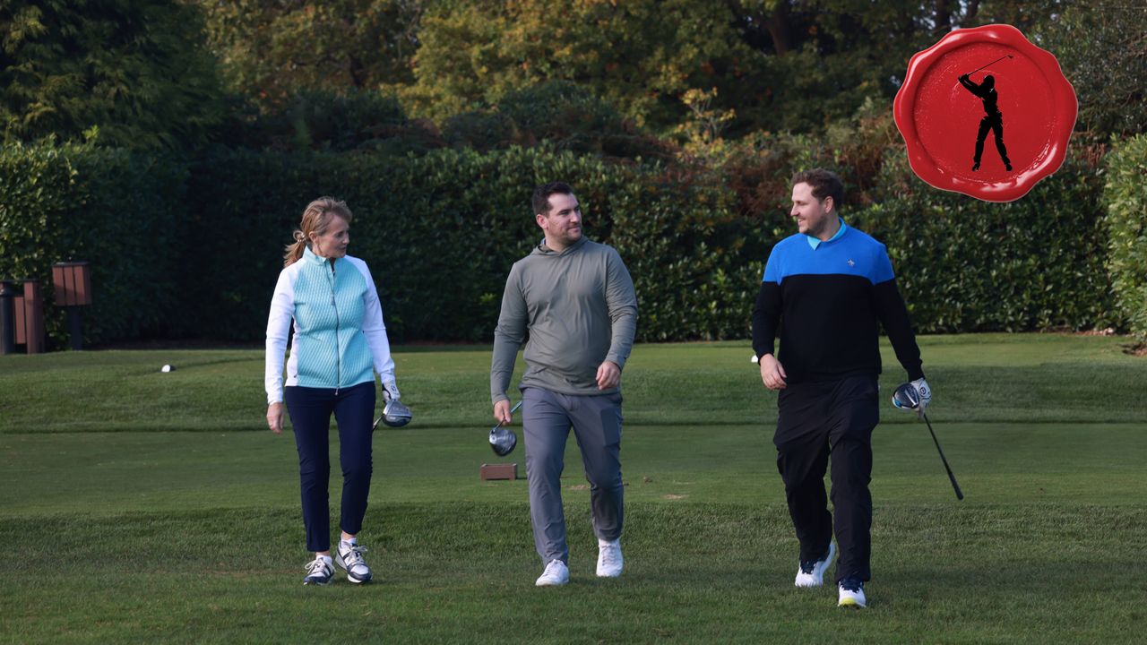 Male and female golfers walking off the tee