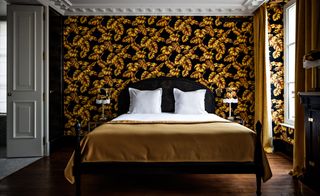 Bedroom with leaves printed background