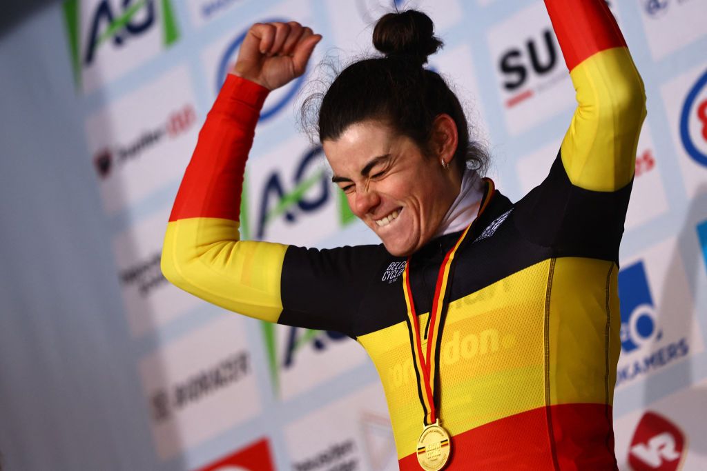 Belgium's Marion Norbert Riberolle celebrates on the podium after winning the women's Elite race, the Belgian Championships cyclocross, in Heusden-Zolder on January 11, 2025. (Photo by DAVID PINTENS / Belga / AFP) / Belgium OUT