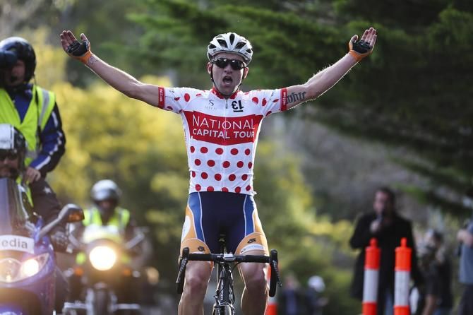 Nathan Earle (Huon-Genesys) salutes another hill-top victory
