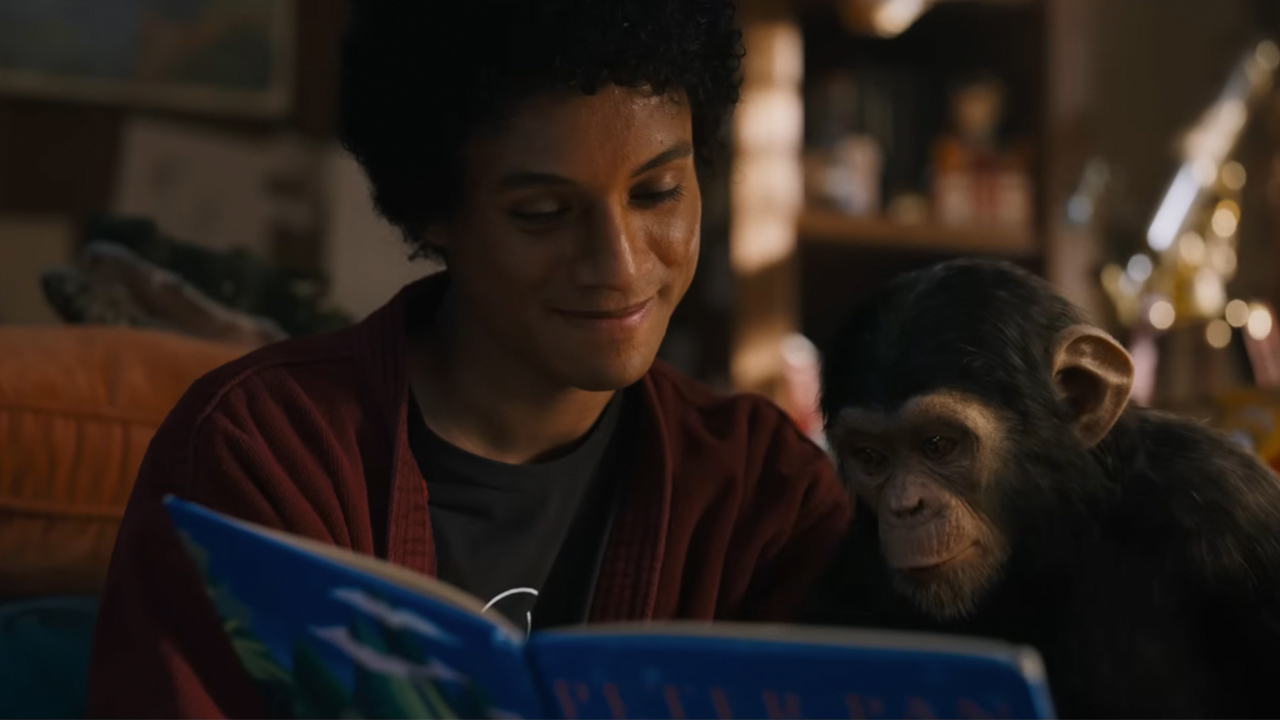Jafaar Jackson as Michael Jackson reading a book to Bubbles the chimp