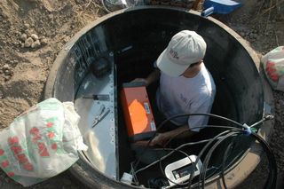 An engineer installs equipment that is part of a network of portable seismometers called the USArray, which provides all its data free to the public. Lekic and his colleagues got a huge amount of data from the project.