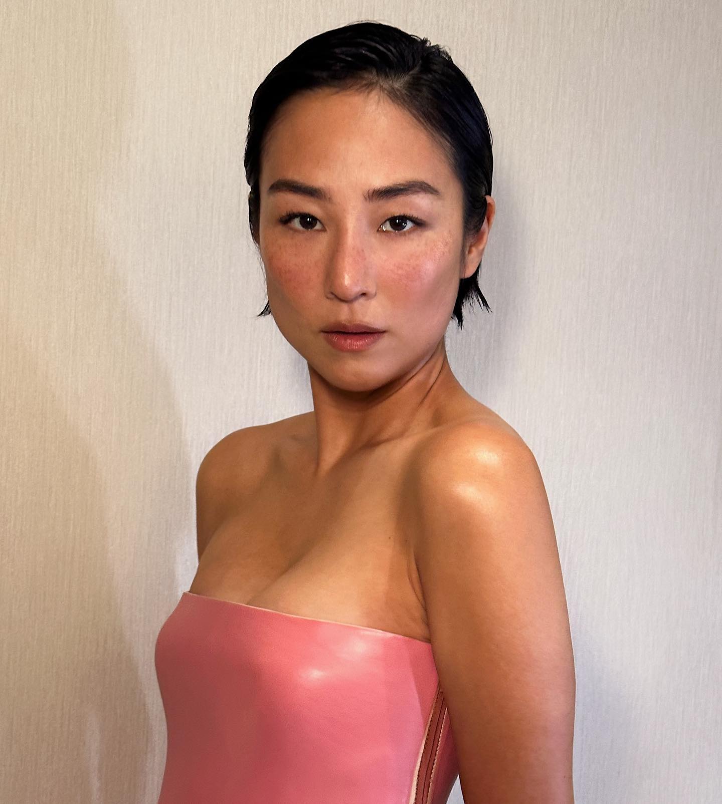 Greta Lee with pixie cut