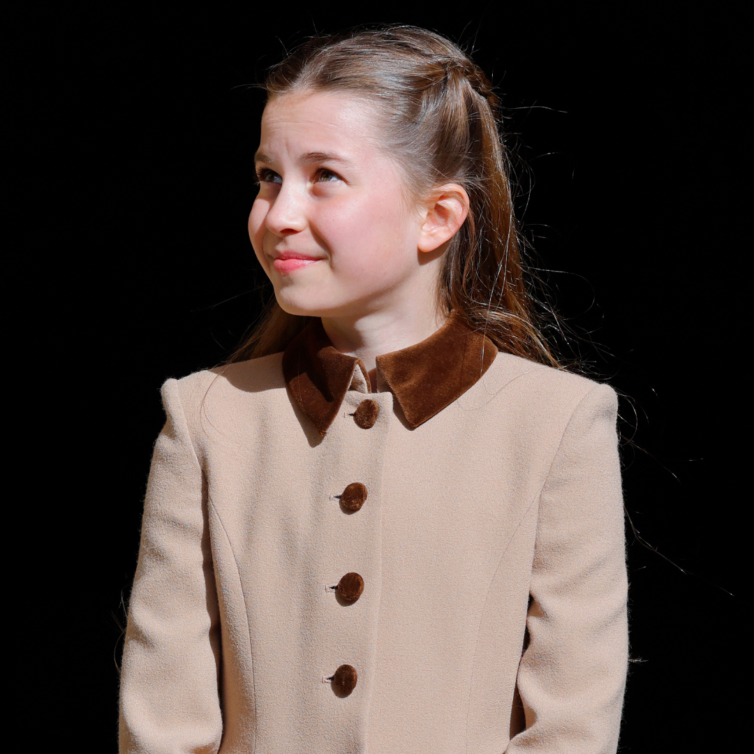 Princess Charlotte wearing a brown coat and smiling