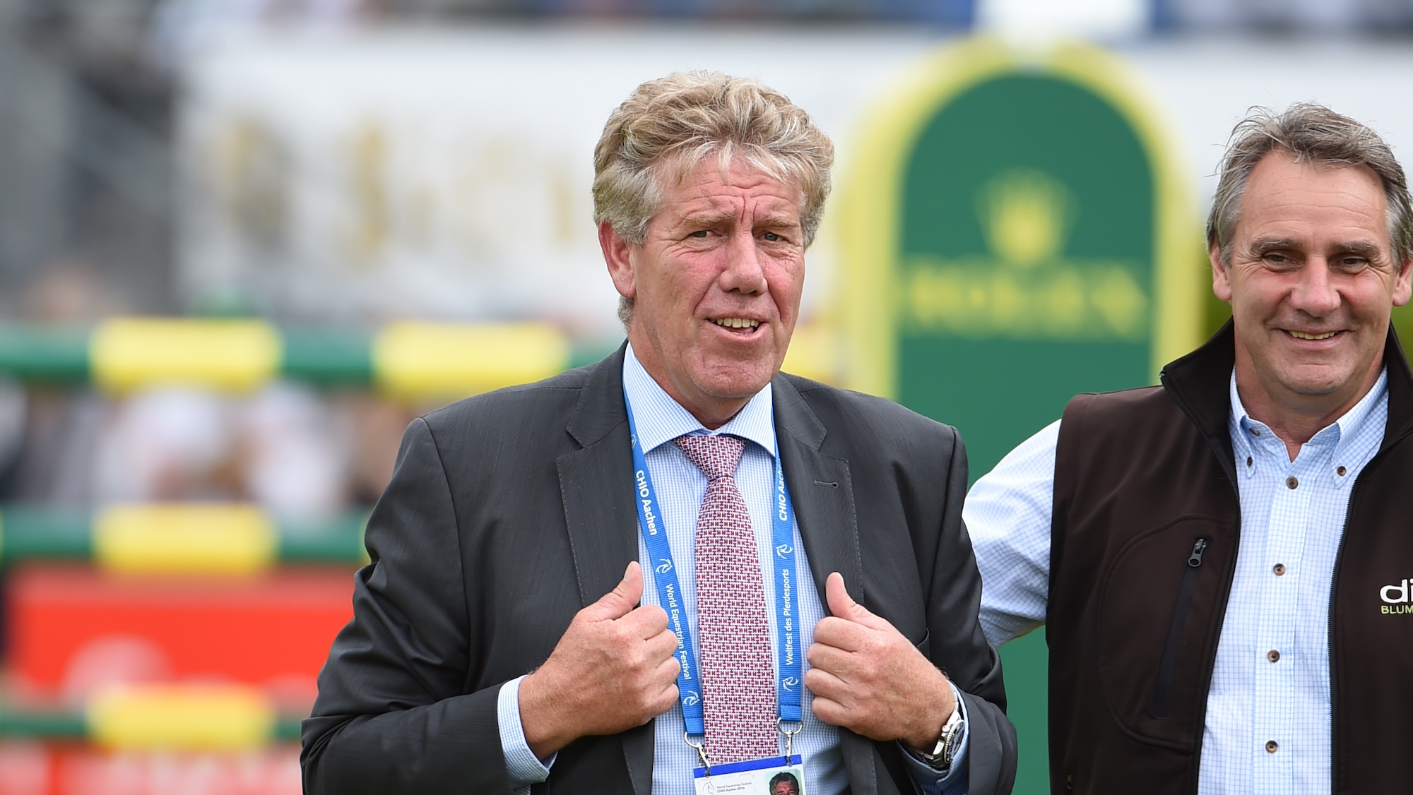 Close up of Frank Rothenberger walking a showjumping course
