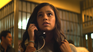Jenna Ortega on the phone in a prison in Season 2 of You