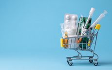 shopping cart with pills, ampoules and syringes in it