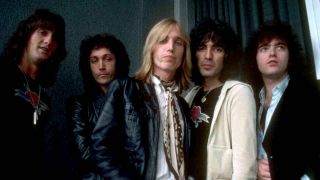 Tom Petty & The Heartbreakers posing for a photograph in 1977