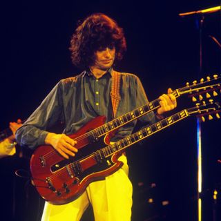 Jimmy Page plays Stairway to Heaven at Knebworth. This was the last time Led Zeppelin appeared in England.