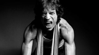 Mick Jagger with his guns out