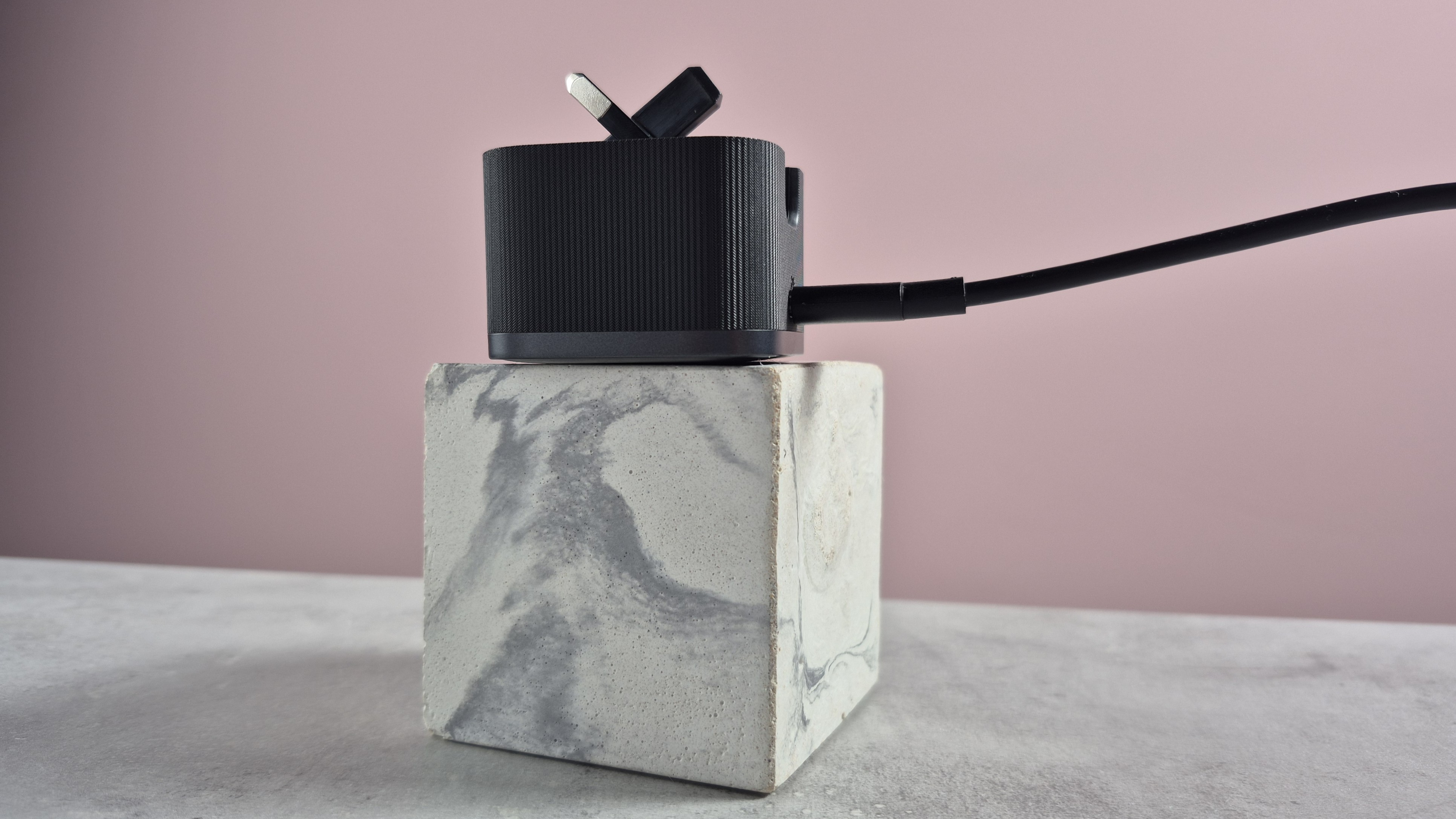 Anker Nano Charger 45W with USB-C Cable on block with prongs semi-folded