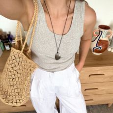 Emily Dawes wears M&S basic vest and linen trousers for summer