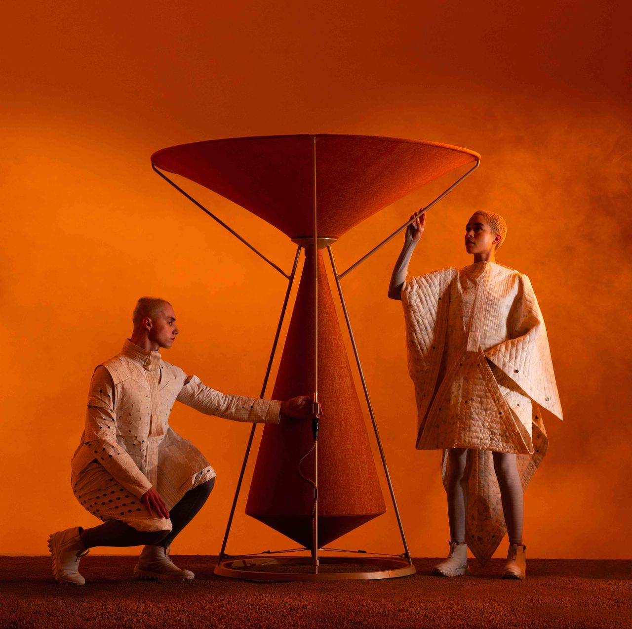 furniture, clothing and accessories on orange backdrop