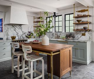 A gray and marble kitchen with power outlet boxes rotated to be horizontal