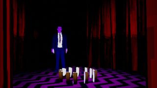 Agent Cooper stands in the Black Lodge.