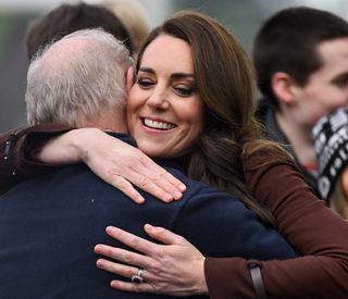 Kate Middleton hugs Jim Embury, her former prep-school teacher