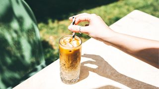 Ice coffee with milk and straw