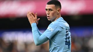 Manchester City's English midfielder #47 Phil Foden reacts after scoring the opening goal of the English FA Cup third round football match between Manchester City and Huddersfield Town at the Etihad Stadium in Manchester, north west England, on January 7, 2024. (Photo by Paul ELLIS / AFP) / RESTRICTED TO EDITORIAL USE. No use with unauthorized audio, video, data, fixture lists, club/league logos or 'live' services. Online in-match use limited to 120 images. An additional 40 images may be used in extra time. No video emulation. Social media in-match use limited to 120 images. An additional 40 images may be used in extra time. No use in betting publications, games or single club/league/player publications. / (Photo by PAUL ELLIS/AFP via Getty Images)