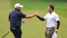 Shane Lowry and Rory McIlroy shake hands on the 18th green