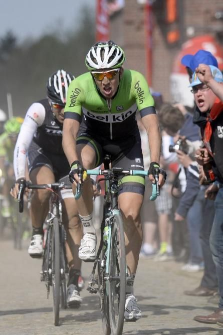 Belgium's Sep Vanmarcke (Belkin) followed by Switzerland's Fabian Cancellara (Trek Factory Racing) rides through a cobblestoned section