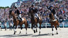 Ros Canter, Tom McEwen and Laura Collett on their victory lap at the Paris 2024 Olympics. All three members of the gold medal-winning team feature among the entries for the 2026 World Championships.