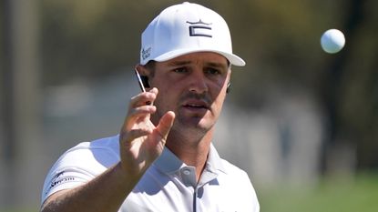 Bryson DeChambeau catches the ball during a WGC-Match Play practice round