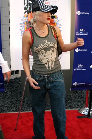 Gwen Stefani wearing a tank top and jeans