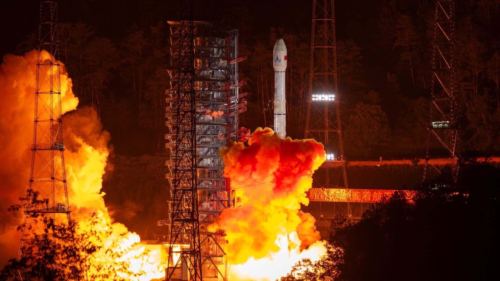 A photo of a Long March 3B rocket launching in China at night