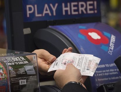 A man buys a Powerball ticket in Washington, D.C.