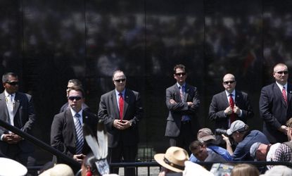 U.S. Secret Service agents watch the crowd during a speech by President Obama in Washington, May 28, 2012. 