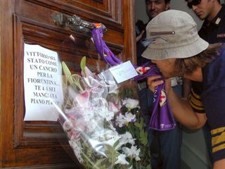A Fiorentina fan mourns the 'death' of the club following their relegation to Serie B in 2002.