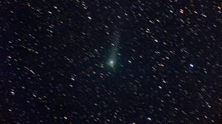 comet k2 streaking through the sky