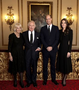 In this handout image issued by Buckingham Palace, Camilla, Queen Consort, King Charles III, Prince William, Prince of Wales and Catherine, Princess of Wales pose for a photo ahead of their Majesties the King and the Queen Consort’s reception for Heads of State and Official Overseas Guests at Buckingham Palace on September 18, 2022 in London, England