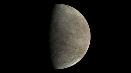 A view of Jupiter's moon Europa captured by NASA's Juno mission during its Sept. 29 close flyby at the moon. The spacecraft was 945 miles (1,500 kilometers) above the moon's surface when the image was taken.