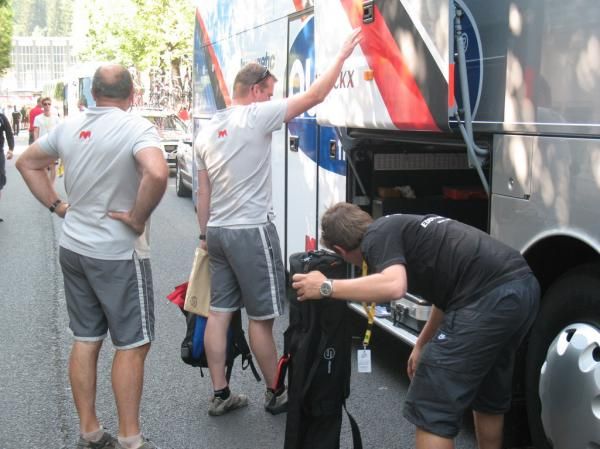 The mechanics take out their equipment from the bus