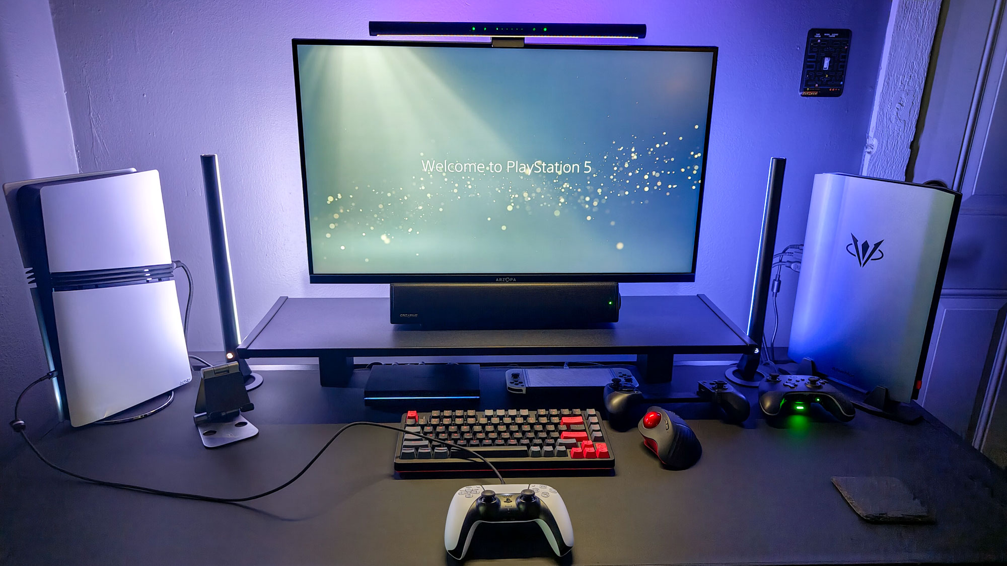 The PS5 Pro and the AtomMan G7 Ti mini PC on either side of a dedicated gaming desk setup