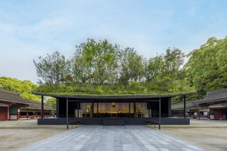 sou fujimoto shrine with green roof shown from outside in japan