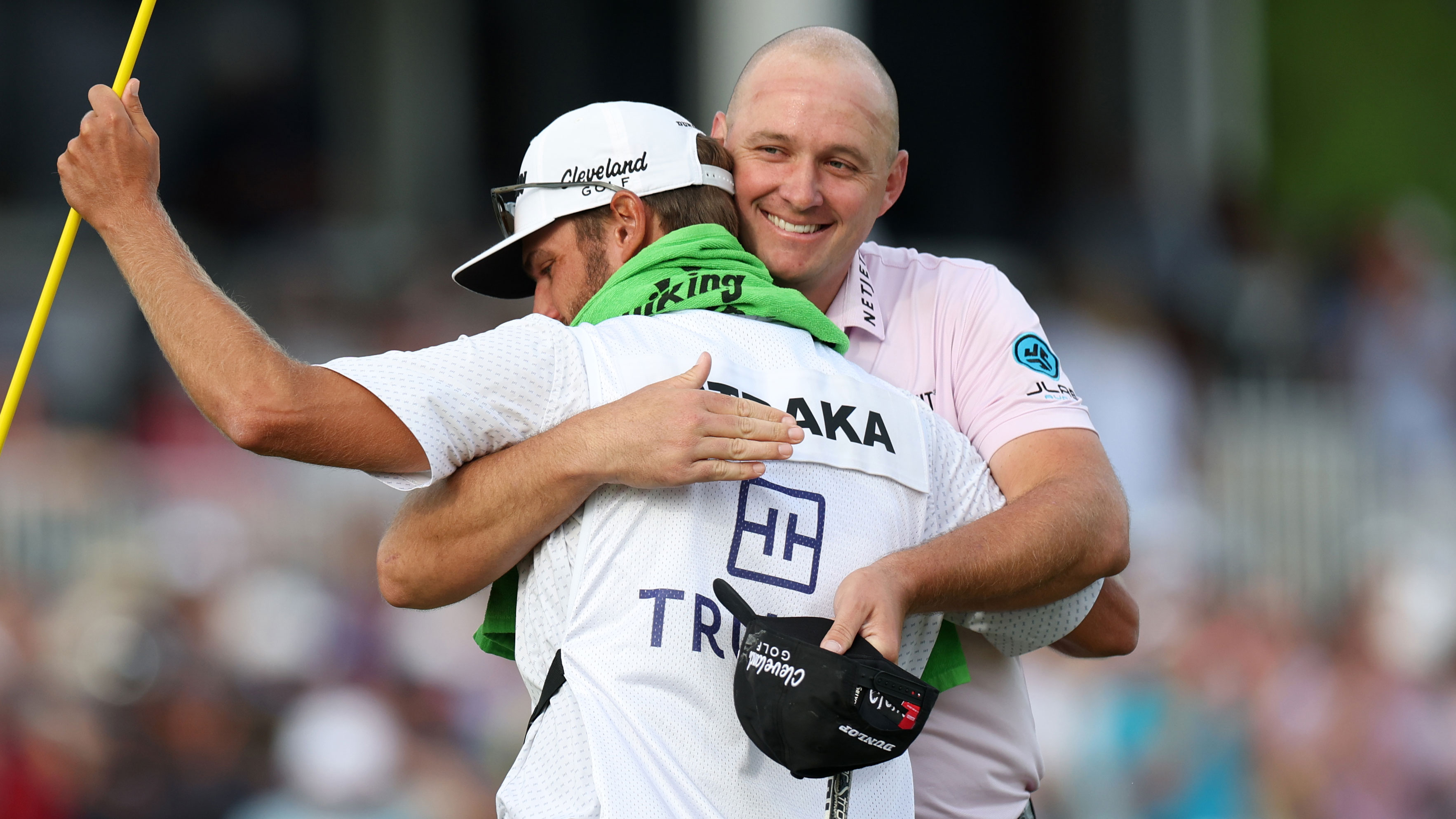 Sepp Straka hugs his stand in caddie Drew Mathers