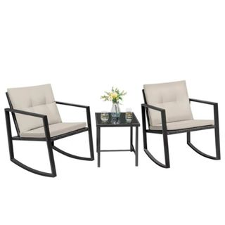 A three piece steel outdoor furniture set with two chairs and a table
