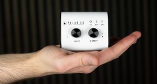 Blackstar Amplification Polar Go: the super-compact audio interface has a white fascia, black knobs and sides, and is small enough to fit inside the palm of your hand.